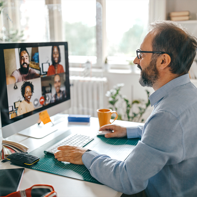 A Man on Zoom Working from Home