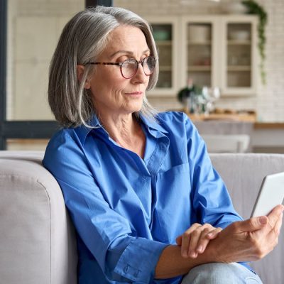 Woman is focused on her cell phone