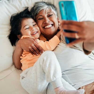 Grandparent and grandchild taking a selfie