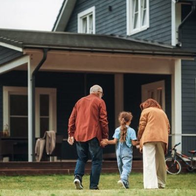 Grandparents outside of their home
