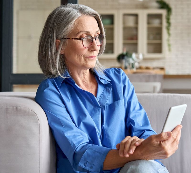 Woman is focused on her cell phone