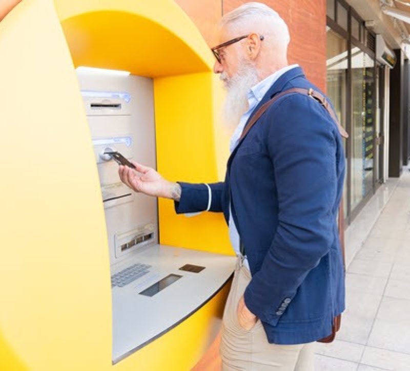 Person at yellow atm