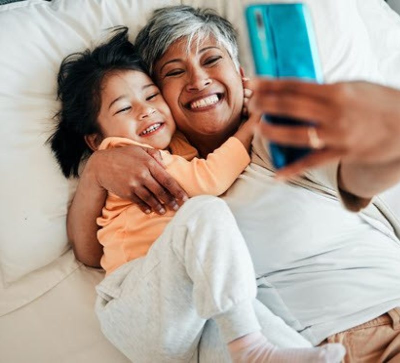 Grandparent and grandchild taking a selfie