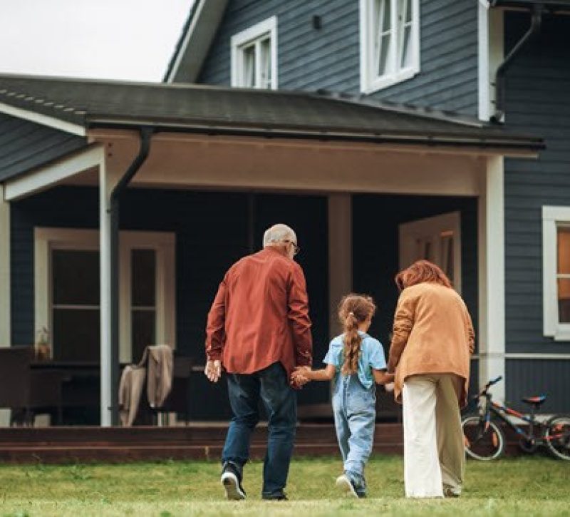 Grandparents outside of their home